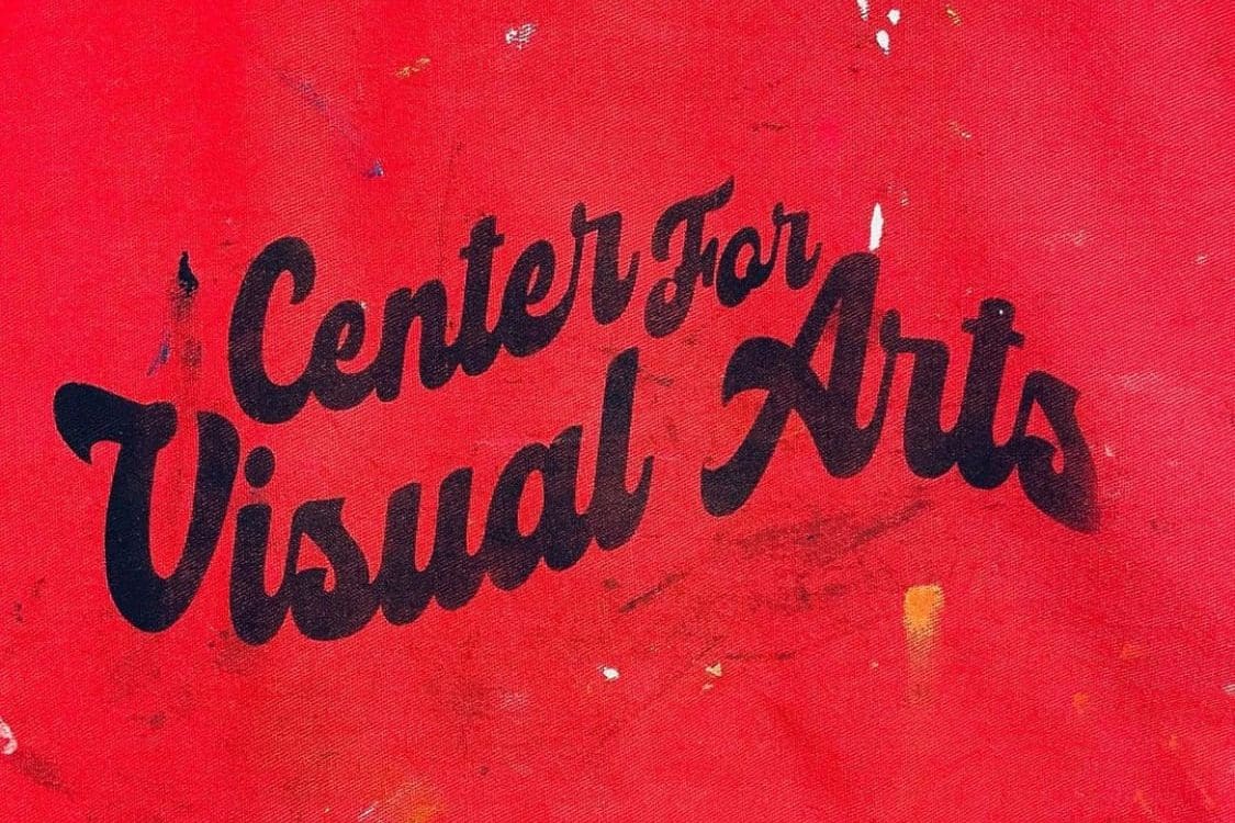 screen printed black text on red background that reads "center for visual arts"